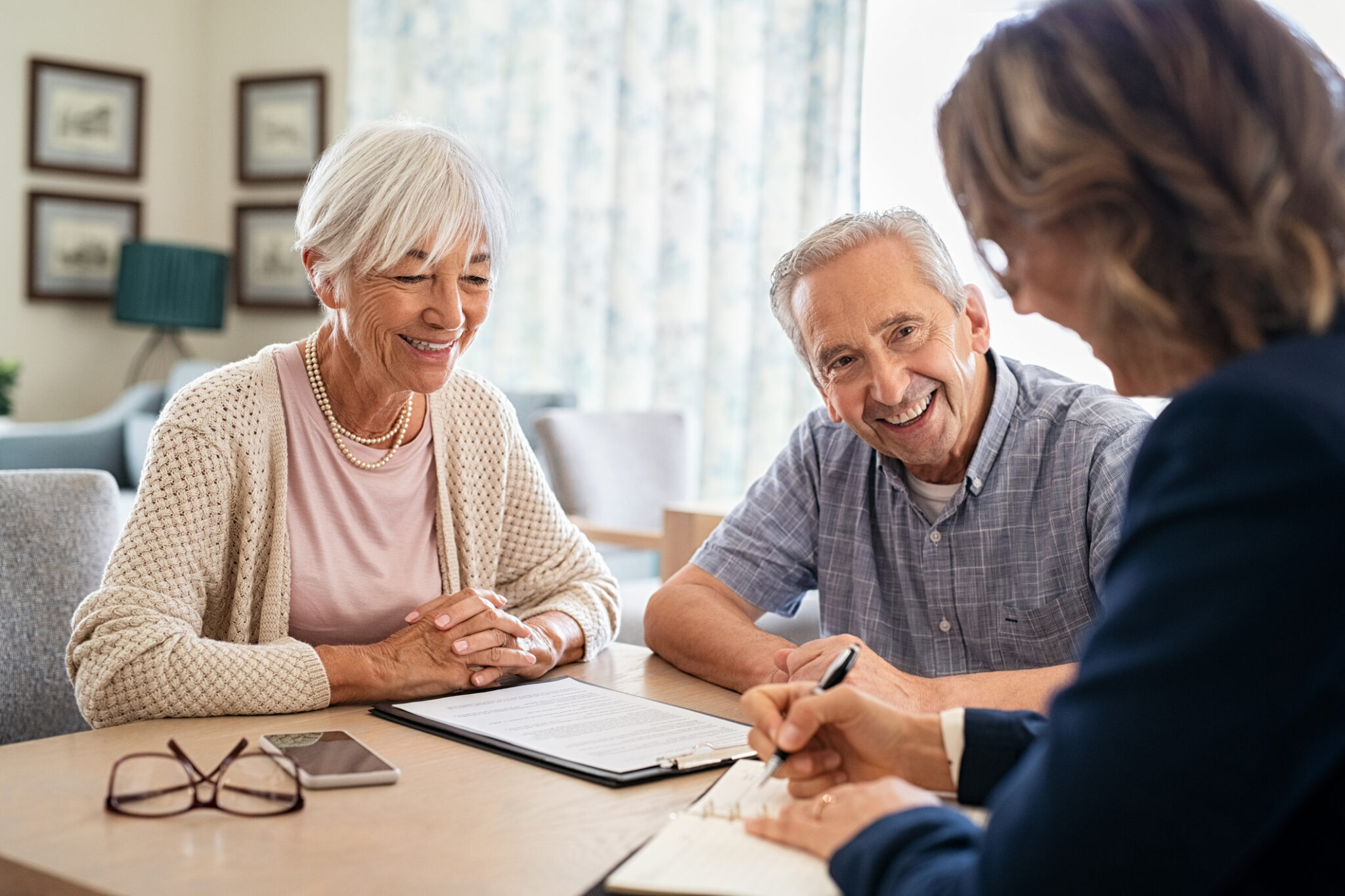 Senior couple meeting with financial advisor.